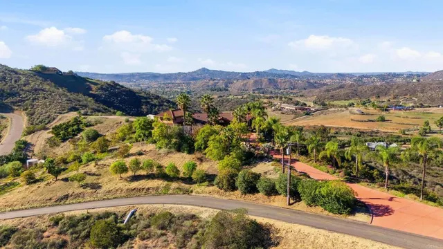 an aerial view of residential house and outdoor space
