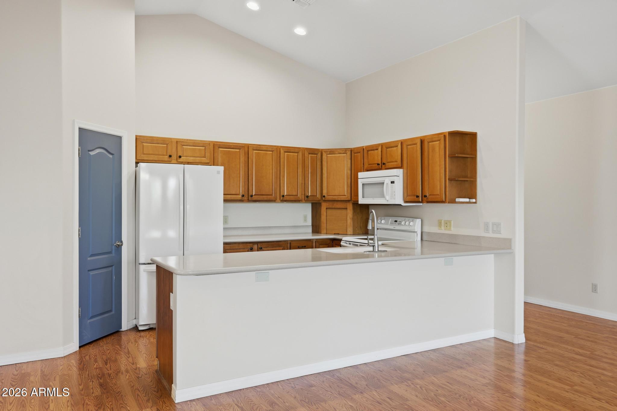 408 East Phoenix Street Payson, AZ 85541 - Photo 10 of 35 a kitchen with stainless steel appliances a refrigerator and a stove top oven