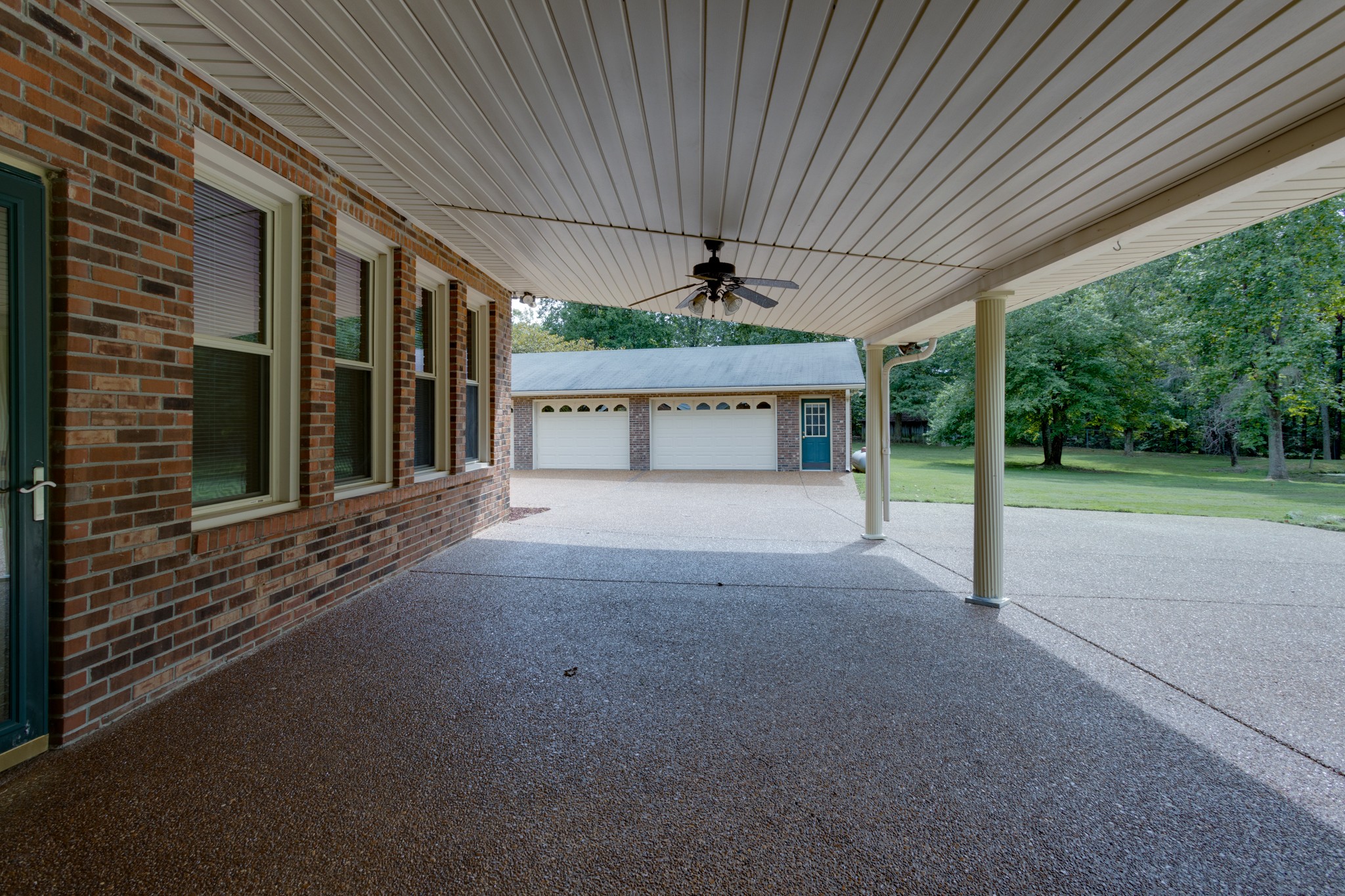 2434 Union Road White House, TN 37188 - Photo 17 of 35 a view of a porch with a table and chairs under an umbrella