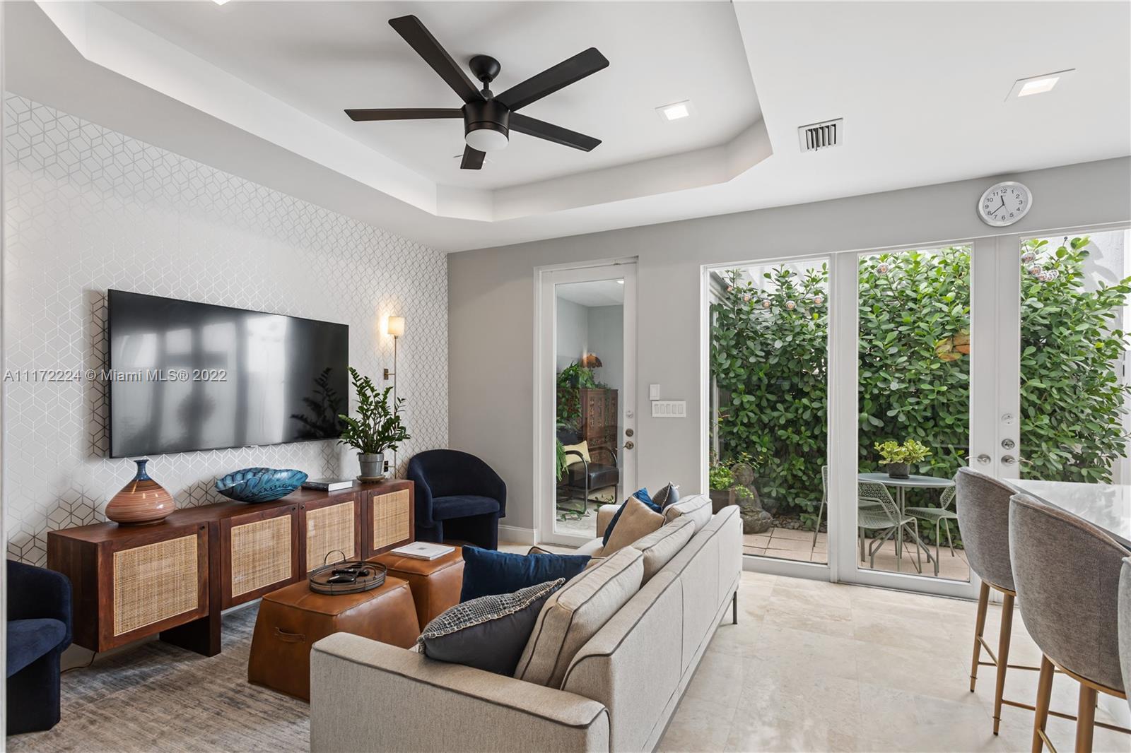 7682 Southwest 54th Avenue Miami, FL 33143 - Photo 13 of 37 a living room with furniture and a flat screen tv