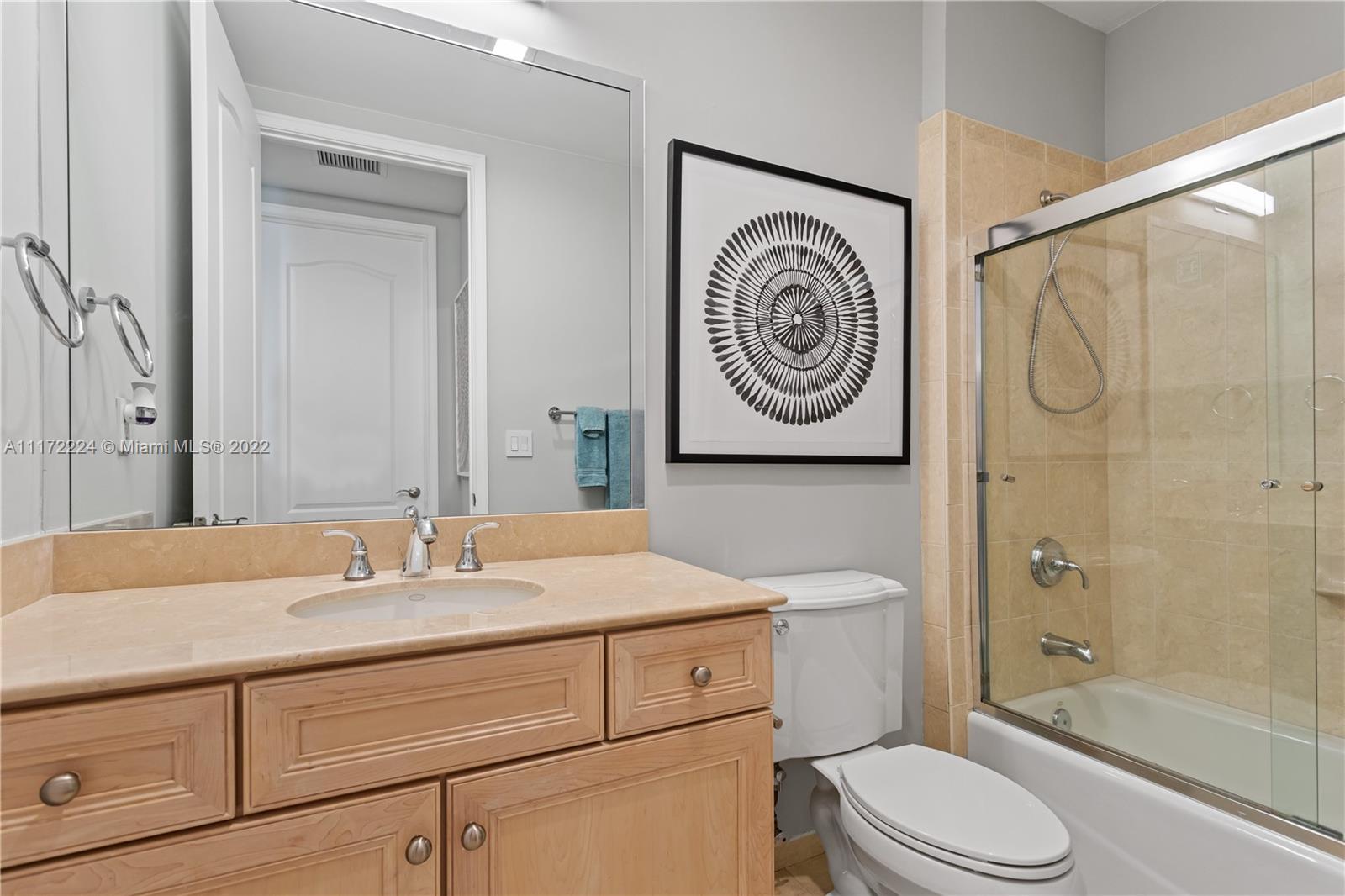 7682 Southwest 54th Avenue Miami, FL 33143 - Photo 26 of 37 a bathroom with a sink a toilet and shower