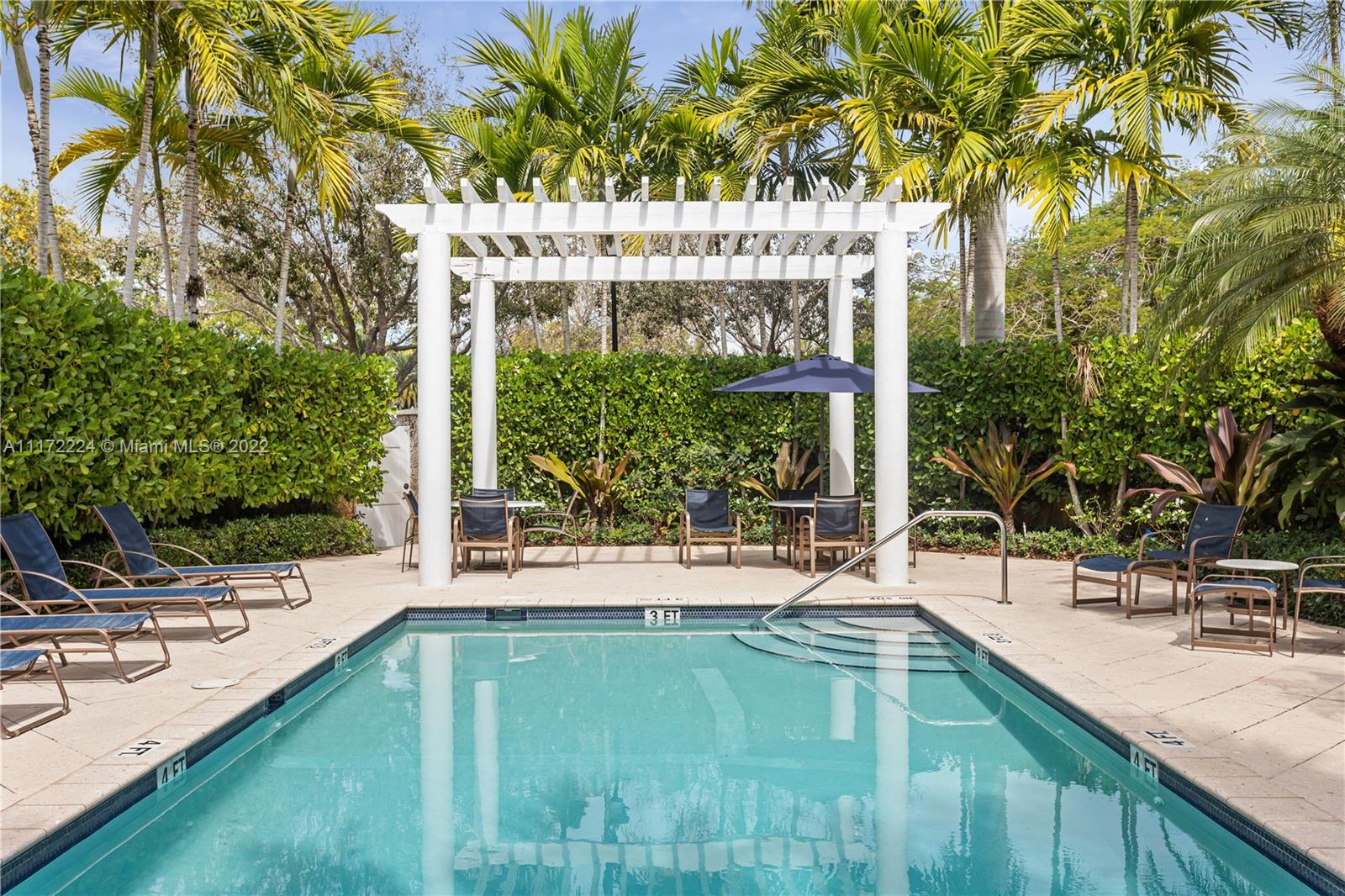 7682 Southwest 54th Avenue Miami, FL 33143 - Photo 28 of 37 a view of a house with a backyard patio and swimming pool