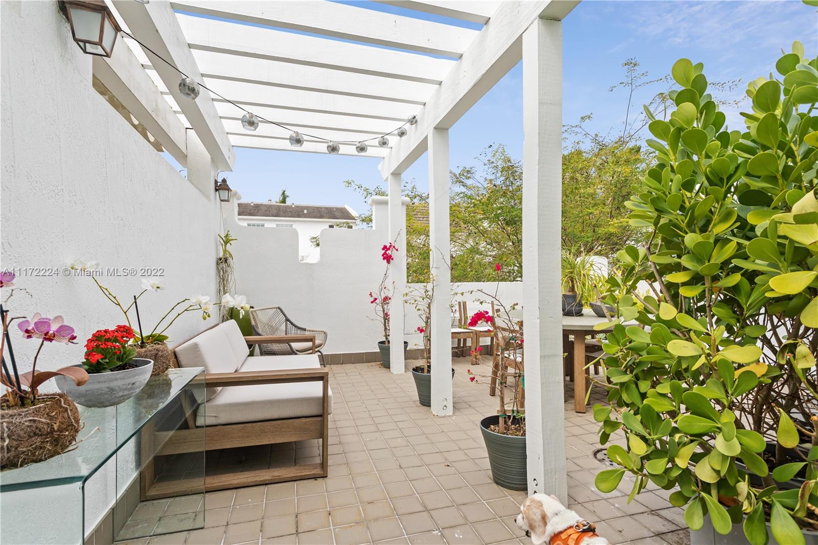 7682 Southwest 54th Avenue Miami, FL 33143 - Photo 30 of 37 a building outdoor space with patio furniture