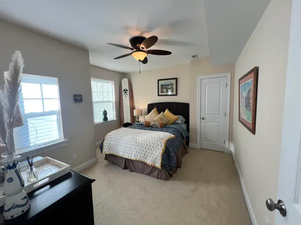 a bedroom with a bed furniture and a window