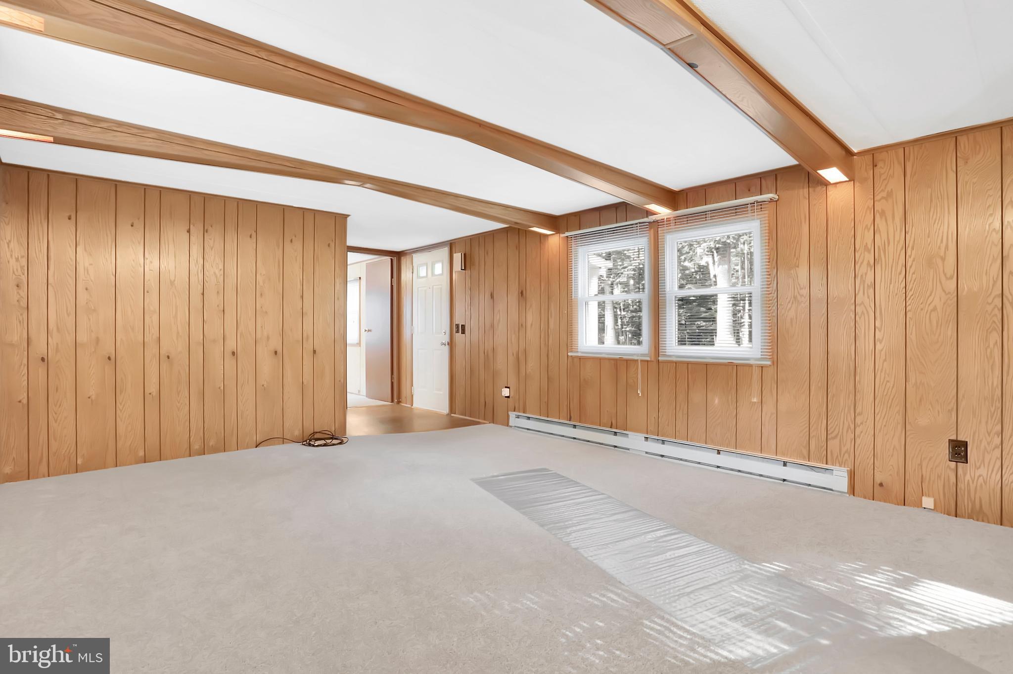 495 Downing Farm Road Front Royal, VA 22630 - Photo 22 of 36 Living room with decorative beams & new carpet