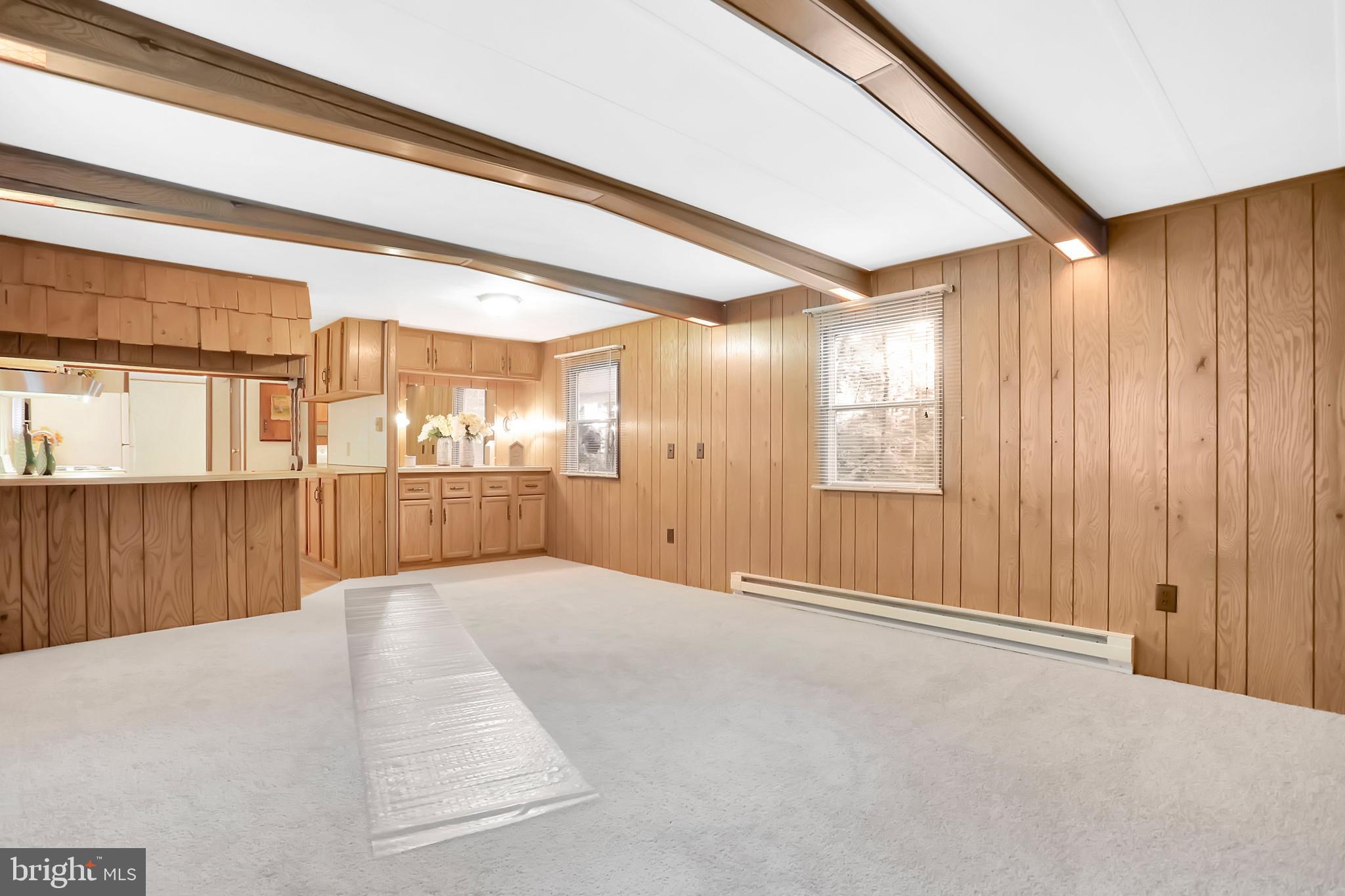 495 Downing Farm Road Front Royal, VA 22630 - Photo 23 of 36 Living room with decorative beams & new carpet