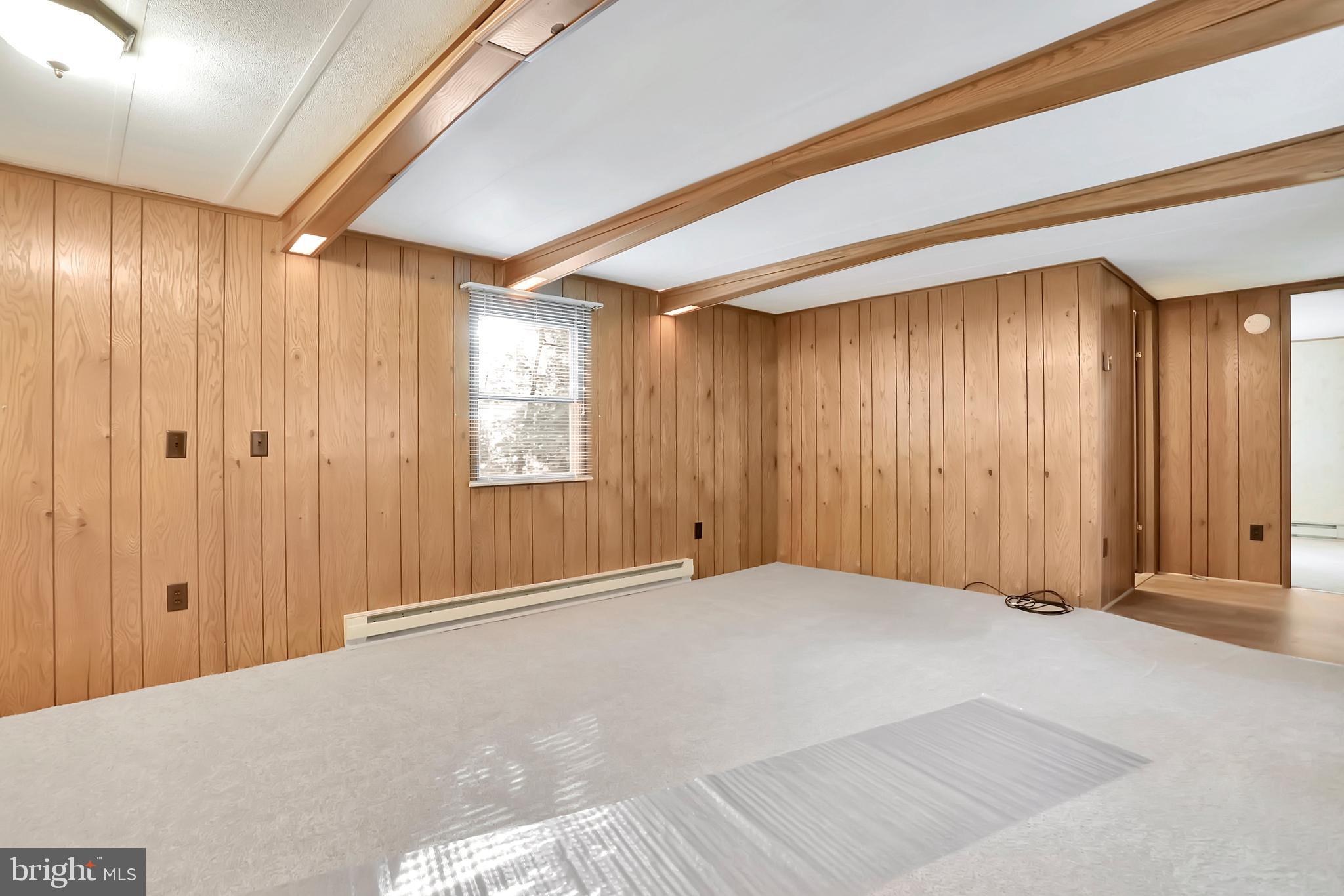 495 Downing Farm Road Front Royal, VA 22630 - Photo 24 of 36 Living room with decorative beams & new carpet