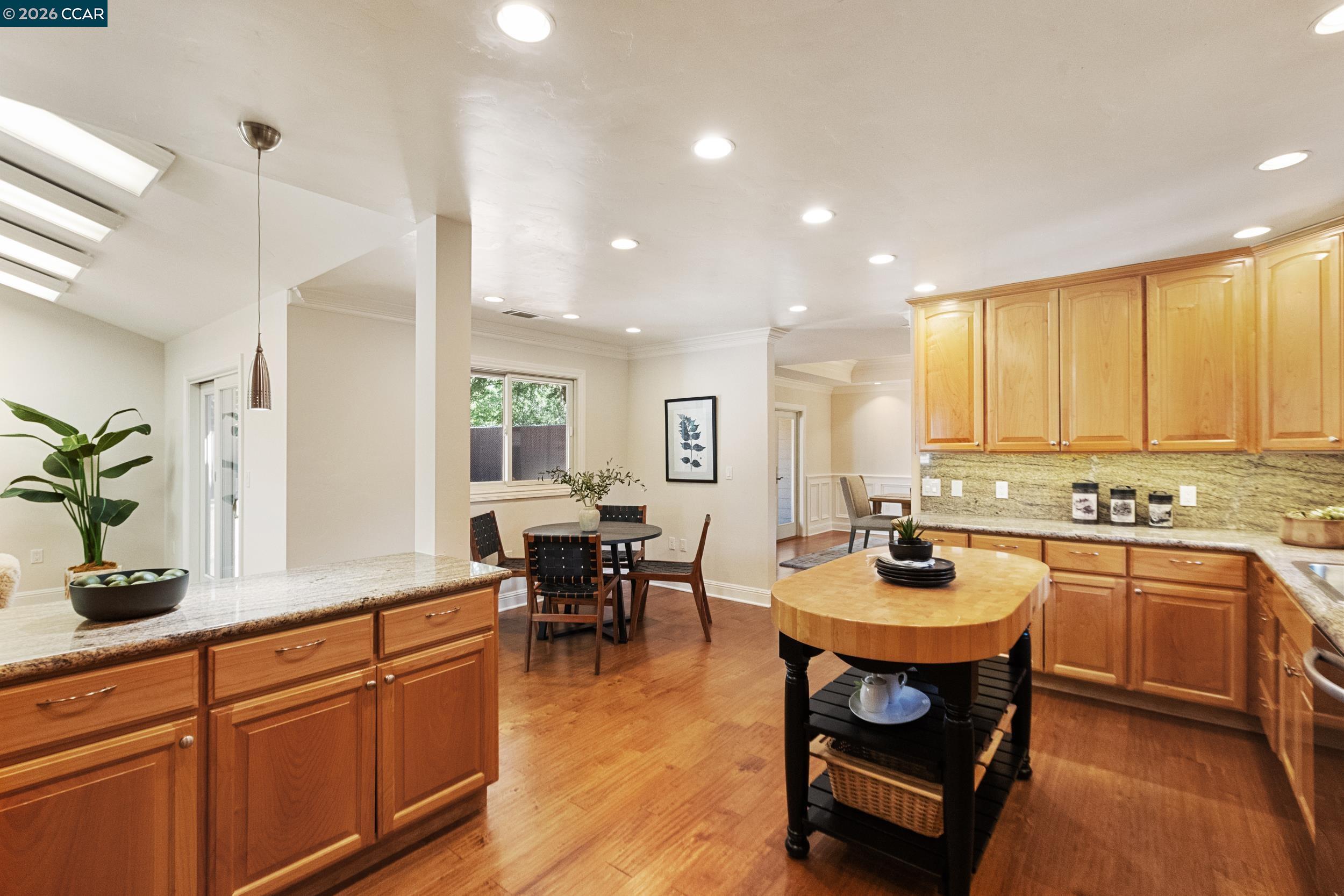484 Diablo Road Danville, CA 94526 - Photo 15 of 39 a kitchen with sink stove dining table and chairs