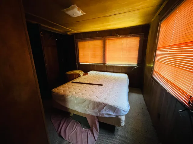 a white toilet sitting next to a small sink