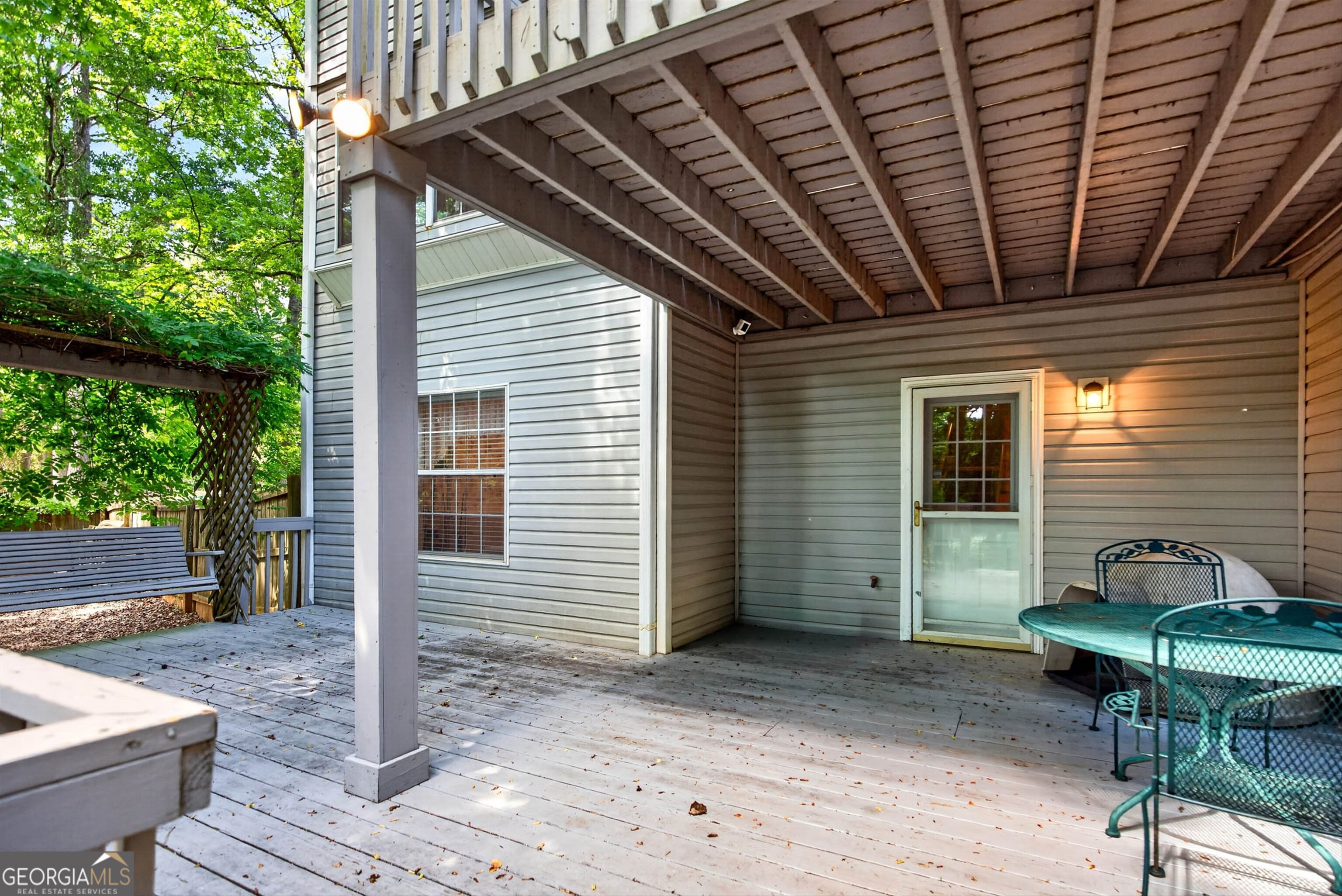 101 Emerald Lane Hampton, GA 30228 - Photo 50 of 72 a backyard of a house with table and chairs
