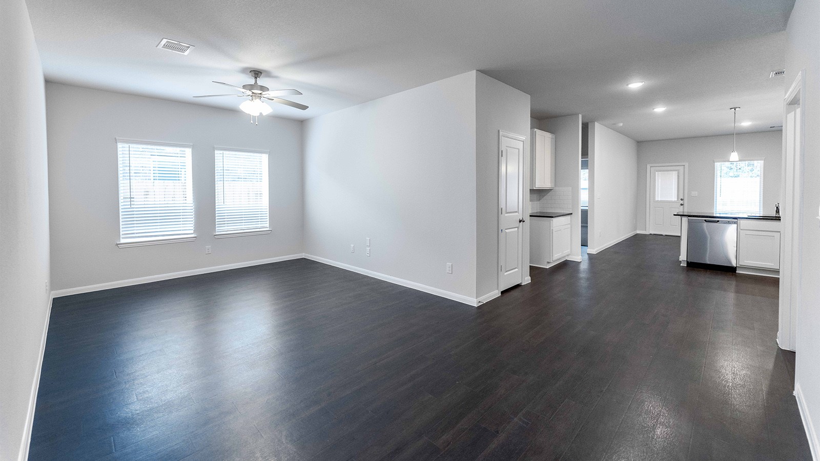 22003 Blue Sky Way New Caney, TX 77357 - Photo 11 of 15 wooden floor in an empty room with a window