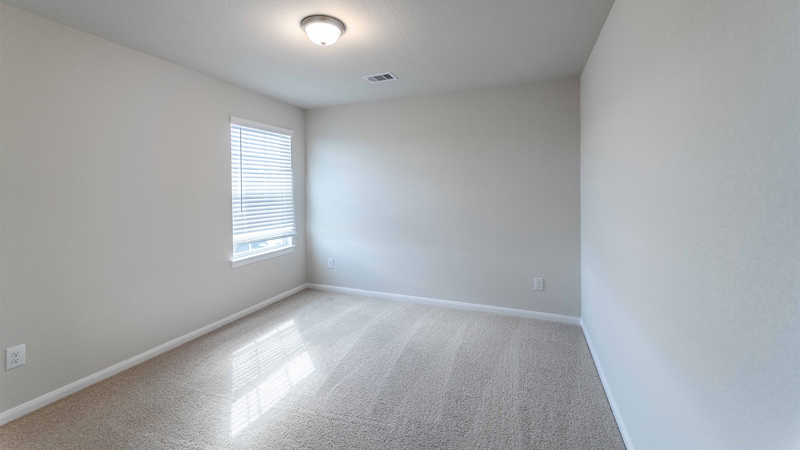 22003 Blue Sky Way New Caney, TX 77357 - Photo 3 of 15 an empty room with windows