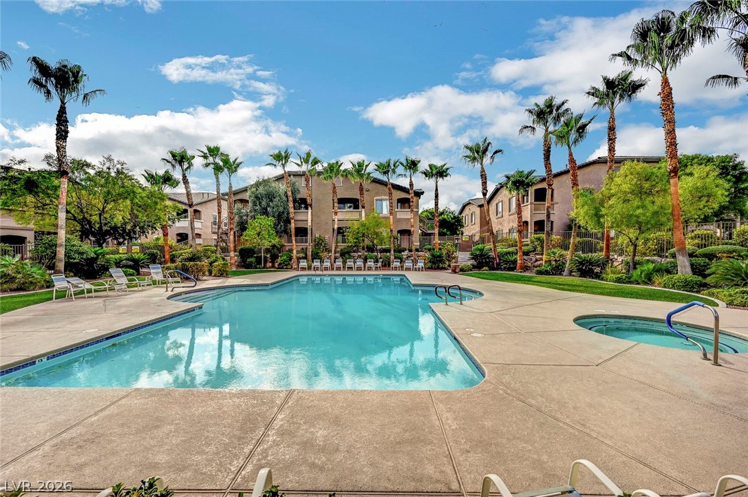 8985 South Durango Drive, Unit 2187 Las Vegas, NV 89113 - Photo 51 of 73 A refreshing outdoor pool and spa await within this verdant community oasis.