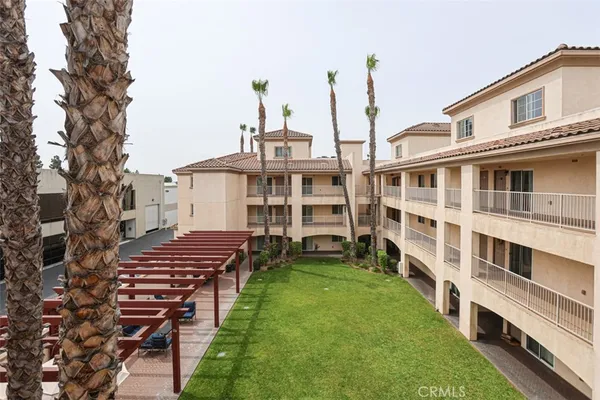 a view of a large building with a yard