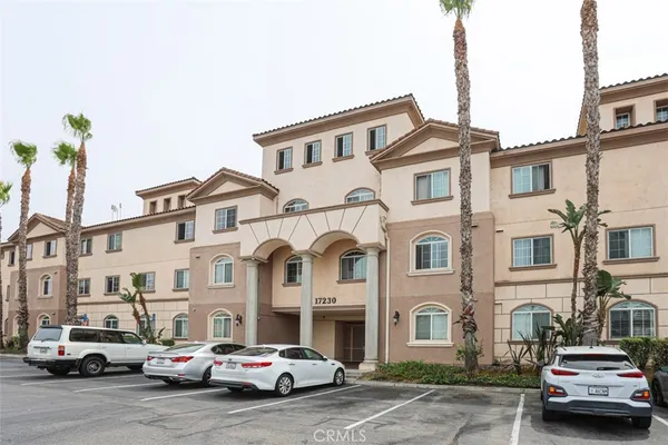 a car parked in front of a white house