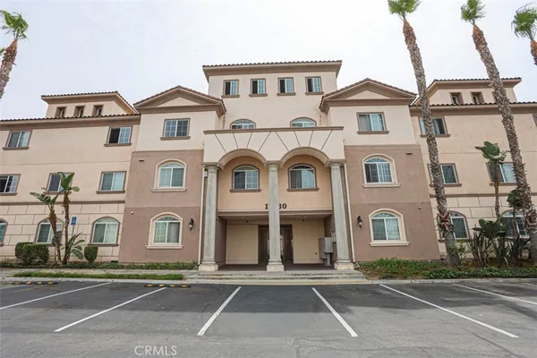 a view of a white house with a large windows