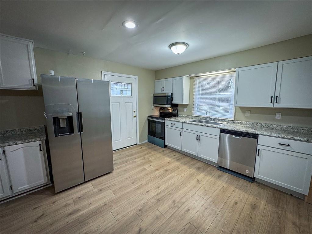 1975 Oneida Valley Road Karns City, PA 16041 - Photo 12 of 35 a kitchen with granite countertop a refrigerator and a stove top oven