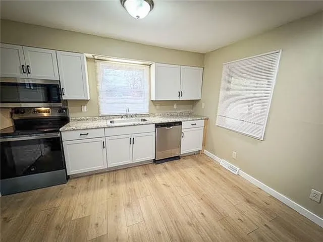 a view of a kitchen with a sink