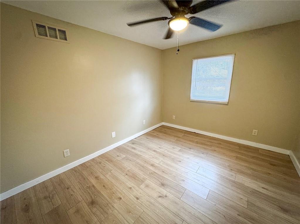 1975 Oneida Valley Road Karns City, PA 16041 - Photo 20 of 35 an empty room with a window and wooden floor