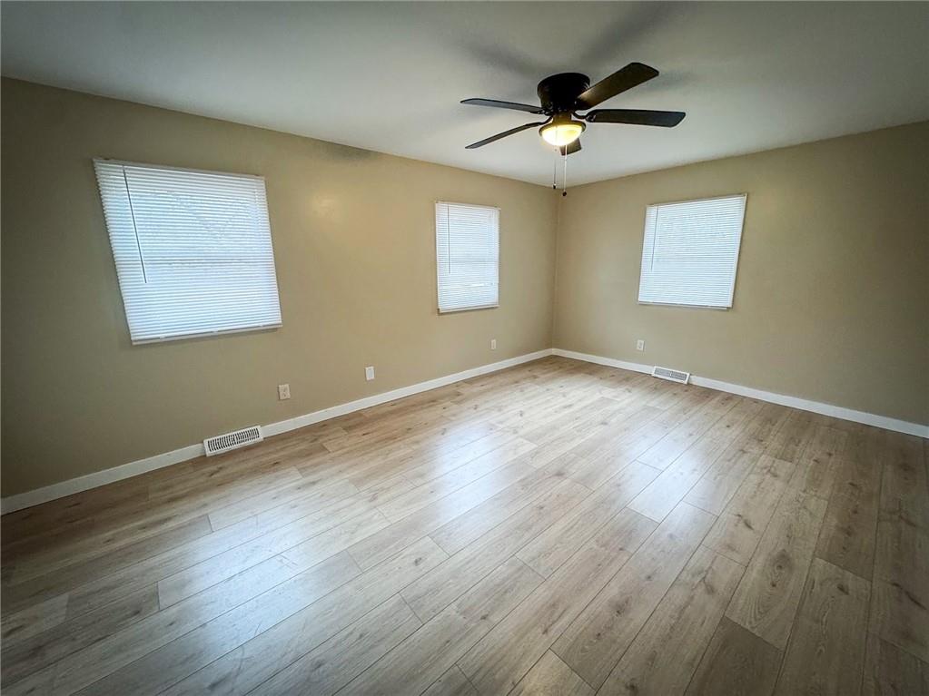 1975 Oneida Valley Road Karns City, PA 16041 - Photo 26 of 35 a view of an empty room with wooden floor and a ceiling fan