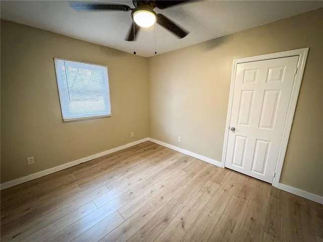a view of a backyard with a sitting area and a garden