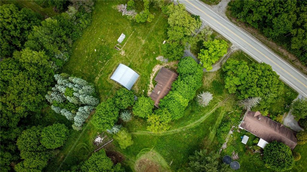 1975 Oneida Valley Road Karns City, PA 16041 - Photo 33 of 35 a backyard of a house with lots of green space and plants