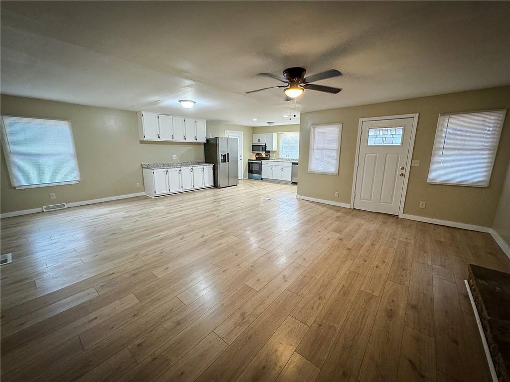 1975 Oneida Valley Road Karns City, PA 16041 - Photo 7 of 35 a view of an empty room with window and wooden floor
