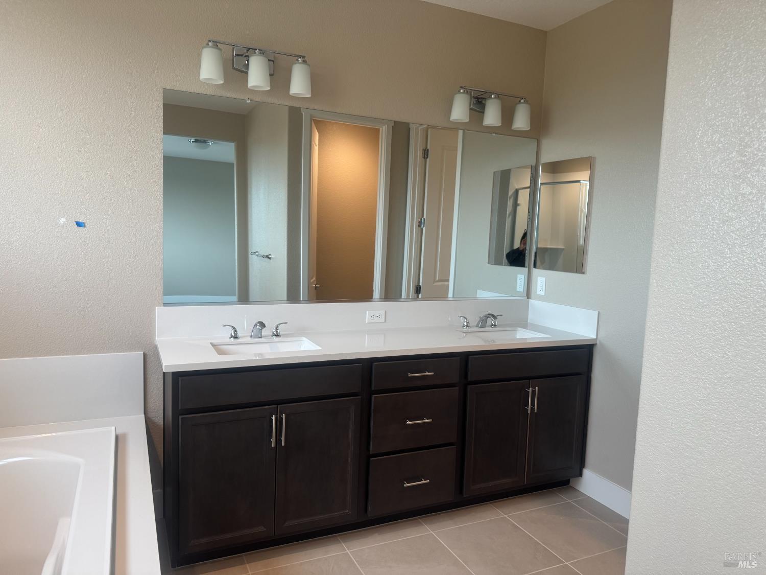 852 Baker Circle Oakley, CA 94561 - Photo 6 of 8 a bathroom with a double vanity sink and mirror