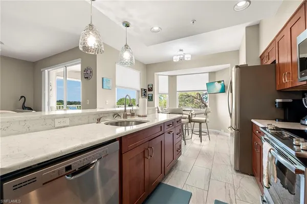 a kitchen with counter top space cabinets and stainless steel appliances