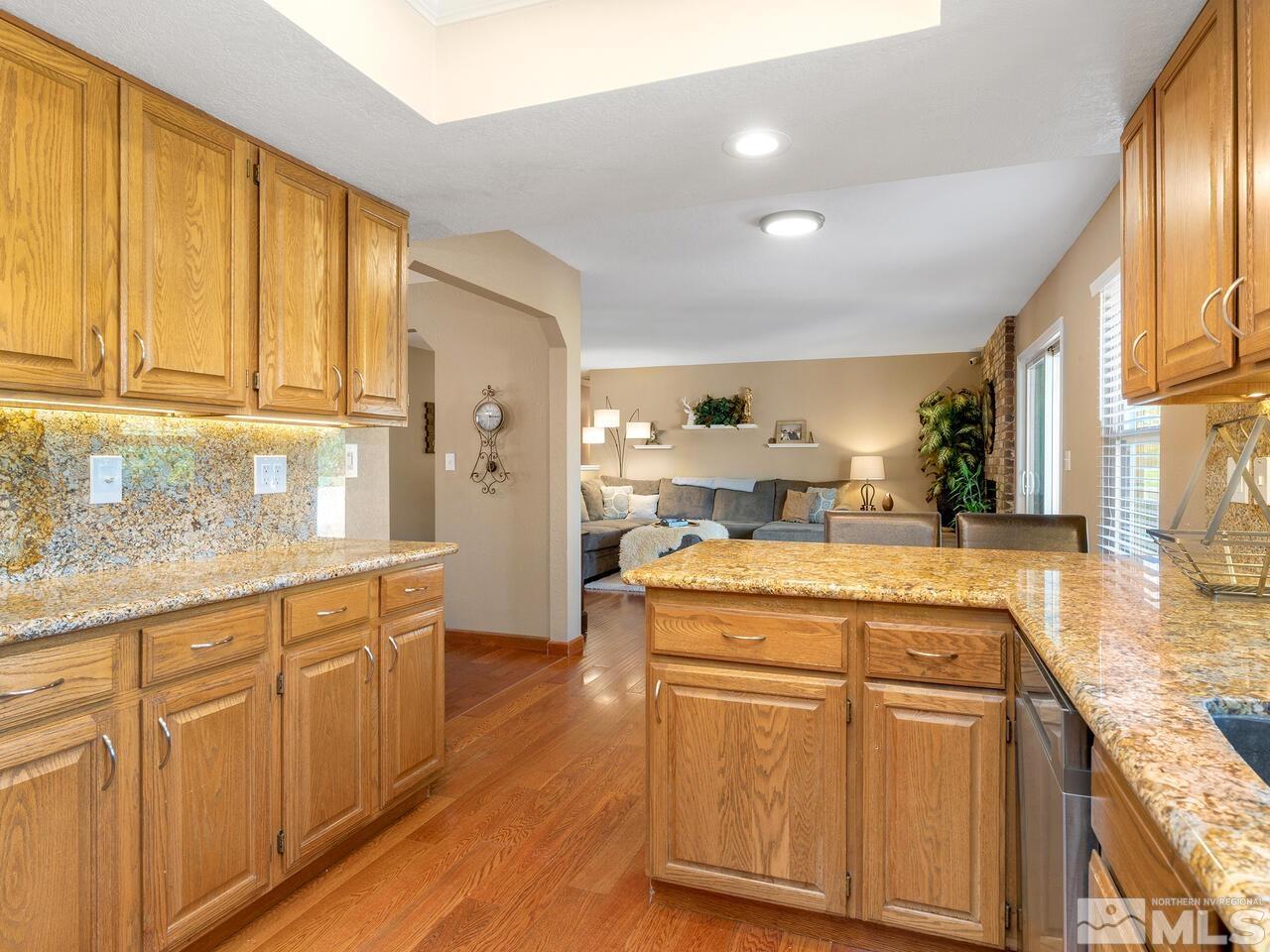 10060 Raintree Court Reno, NV 89511 - Photo 15 of 37 a kitchen with cabinets oven and a counter top space