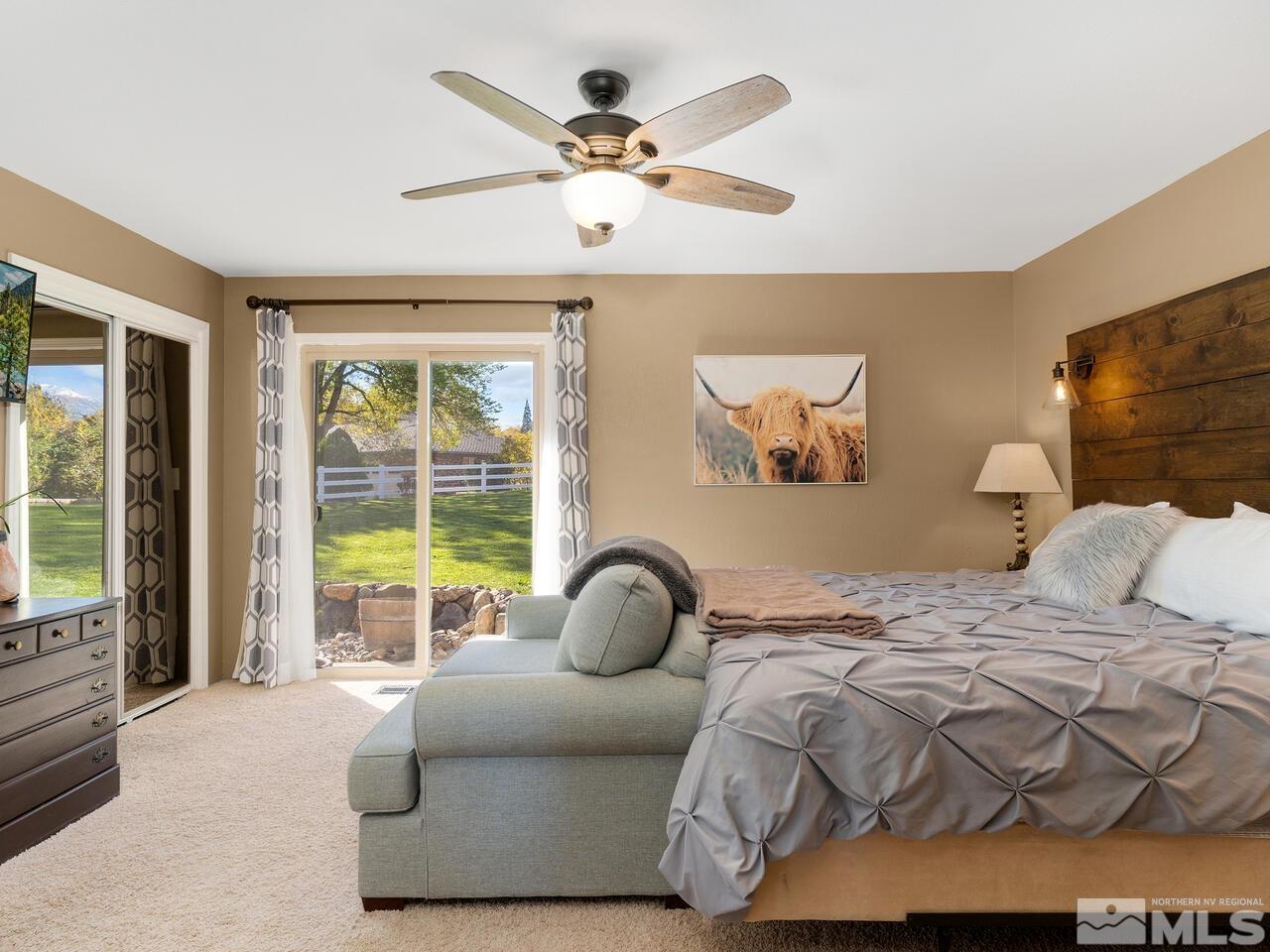 10060 Raintree Court Reno, NV 89511 - Photo 17 of 37 a bedroom with two beds and a large window