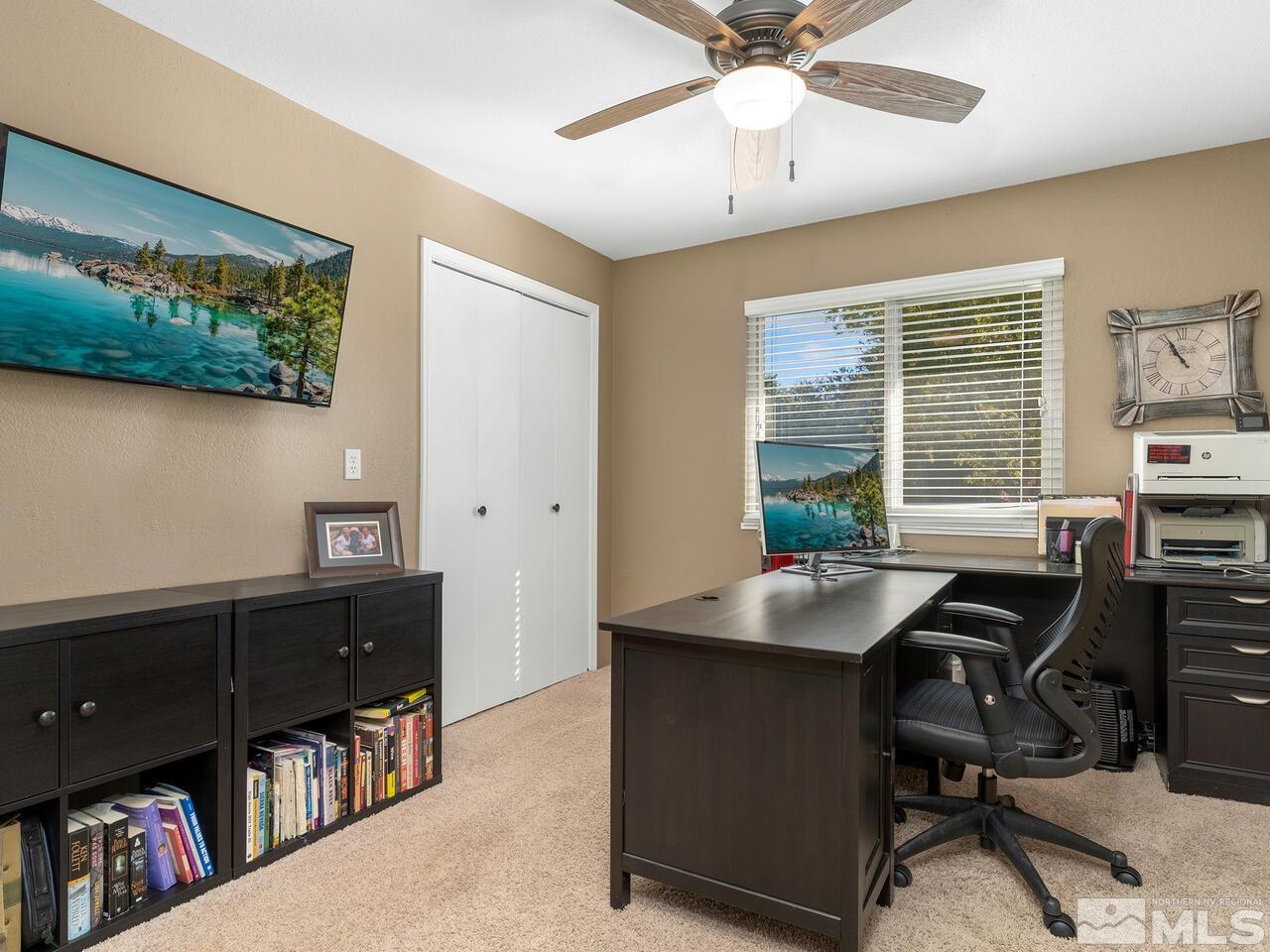 10060 Raintree Court Reno, NV 89511 - Photo 20 of 37 a view of a workspace with furniture and a window