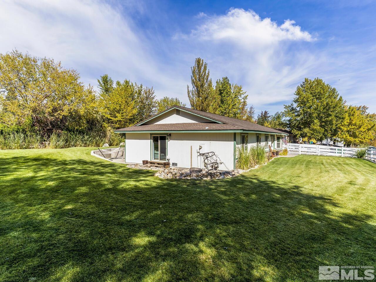10060 Raintree Court Reno, NV 89511 - Photo 26 of 37 a front view of a house with a garden