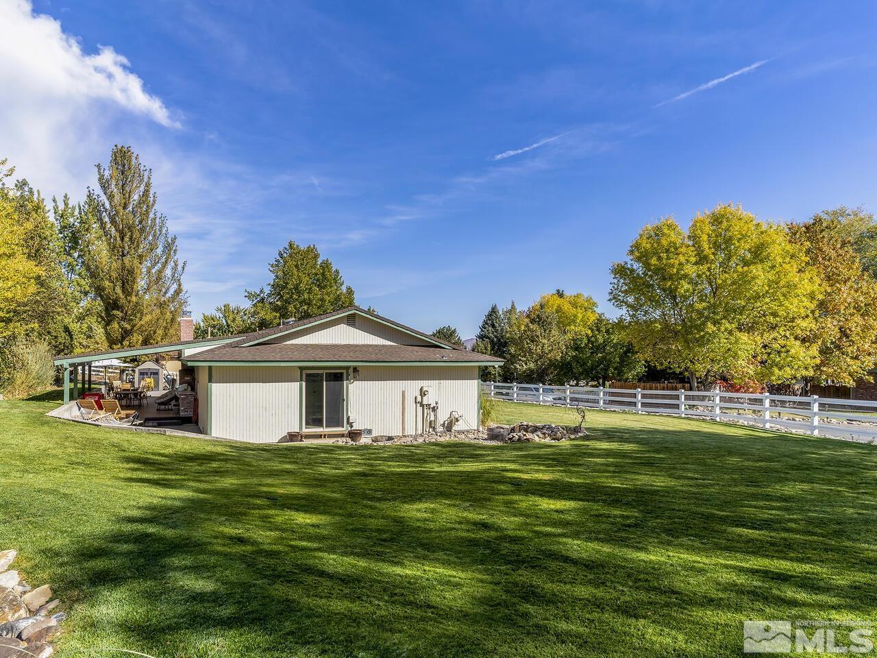 10060 Raintree Court Reno, NV 89511 - Photo 27 of 37 a front view of a house with a yard