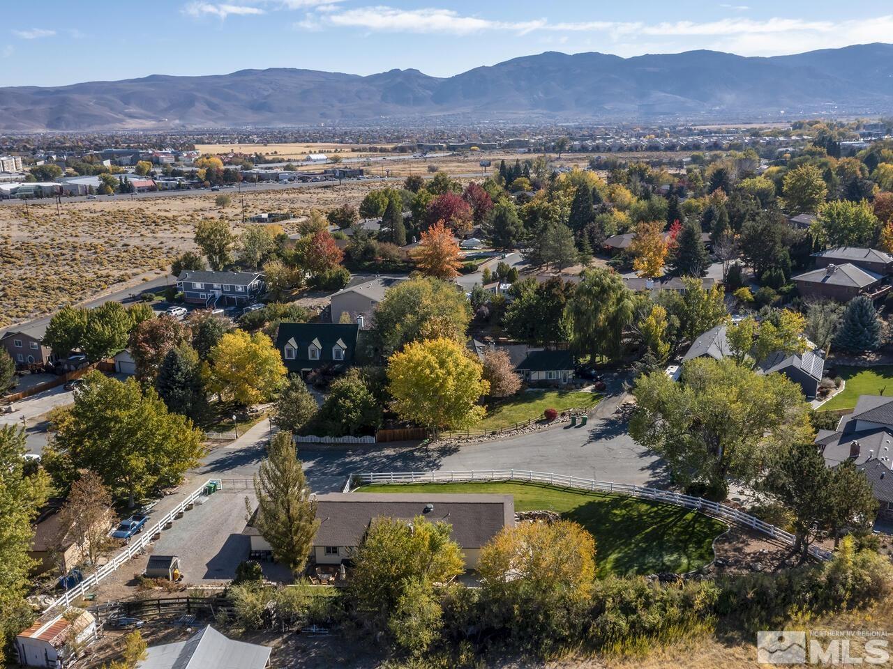 10060 Raintree Court Reno, NV 89511 - Photo 3 of 37 a view of a city with mountains in the background
