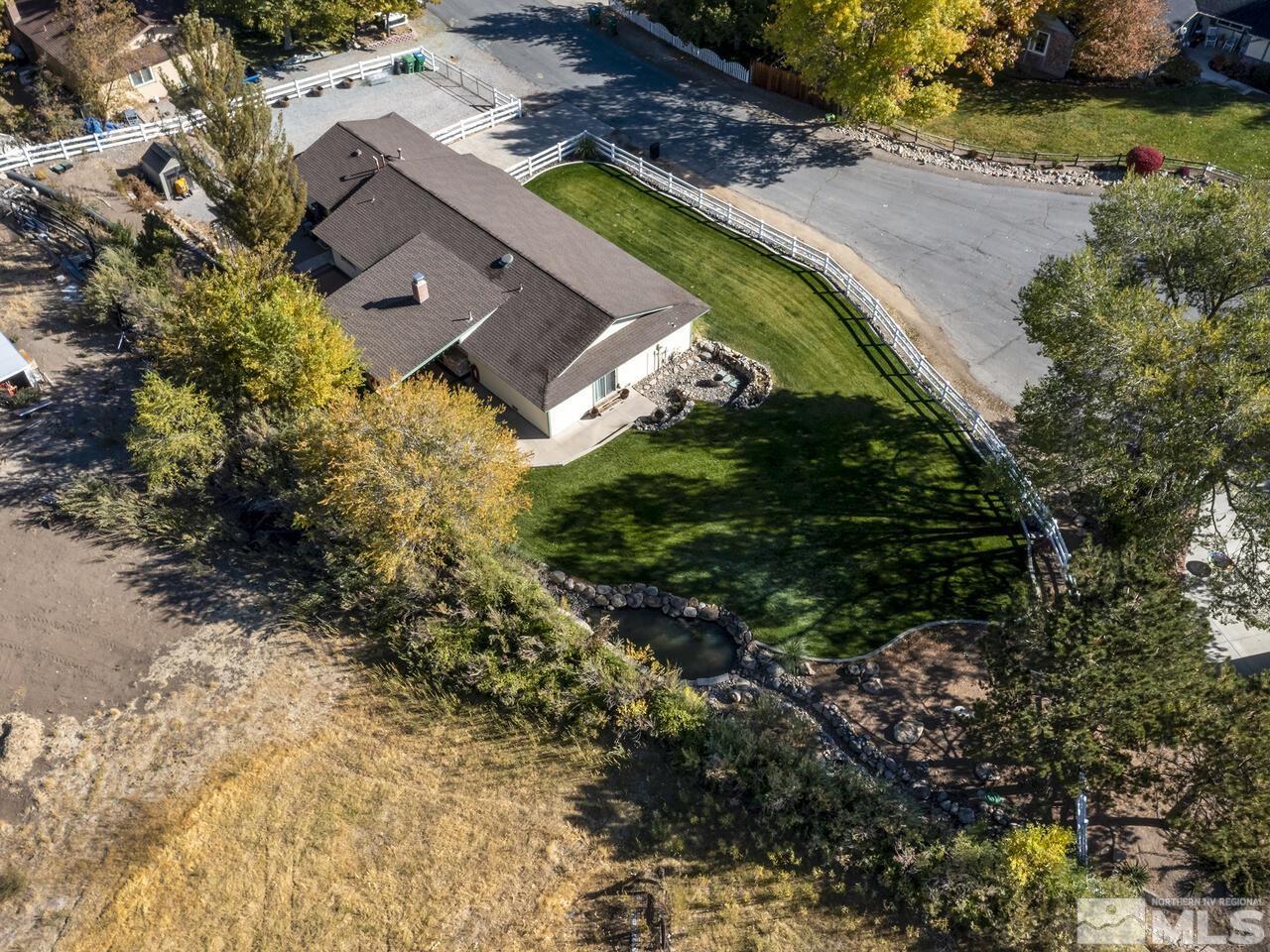 10060 Raintree Court Reno, NV 89511 - Photo 33 of 37 an aerial view of a house with a garden and swimming pool