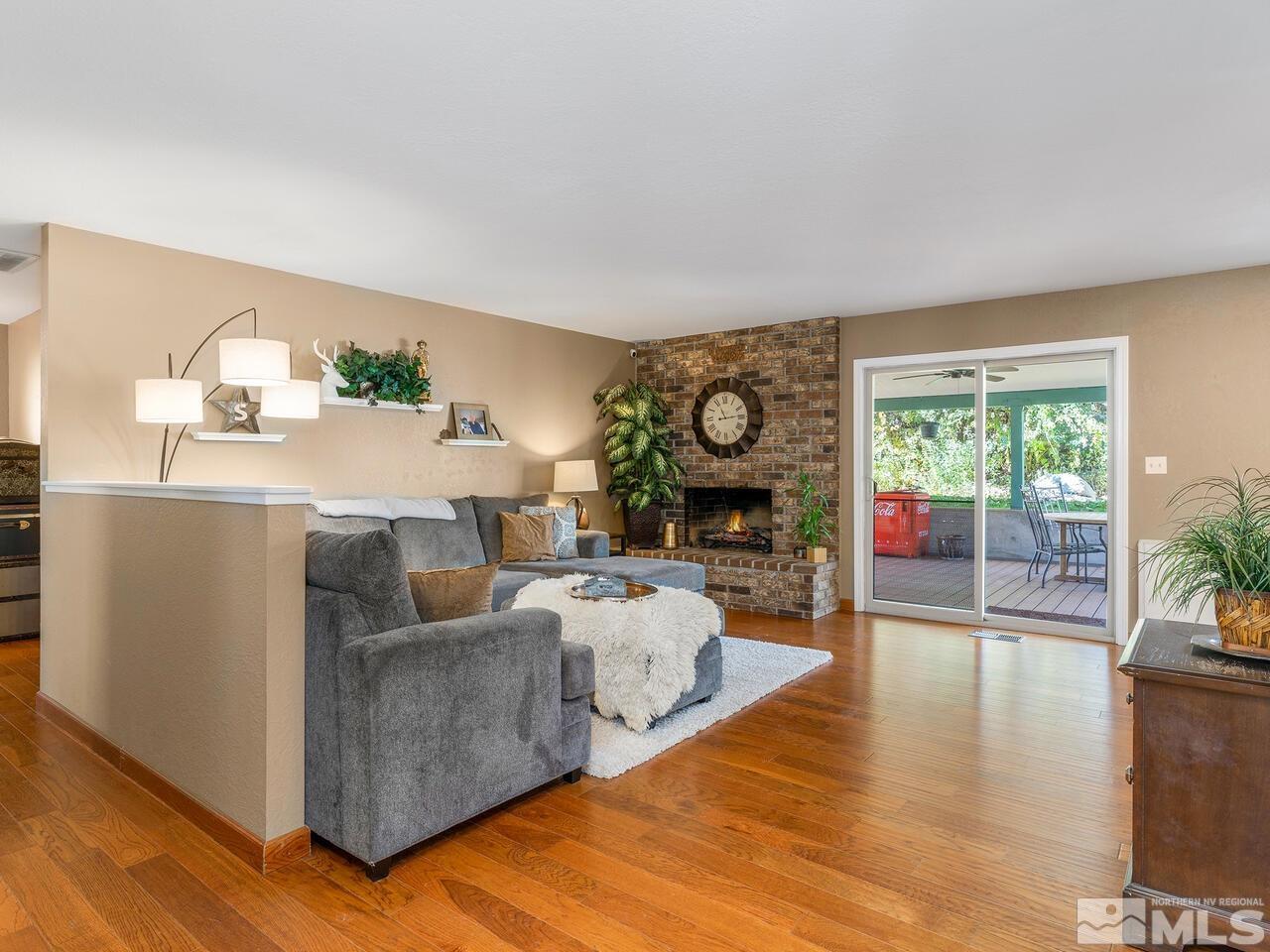 10060 Raintree Court Reno, NV 89511 - Photo 5 of 37 a living room with furniture and a fireplace
