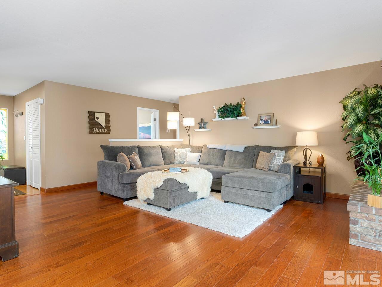 10060 Raintree Court Reno, NV 89511 - Photo 6 of 37 a living room with furniture and a couch