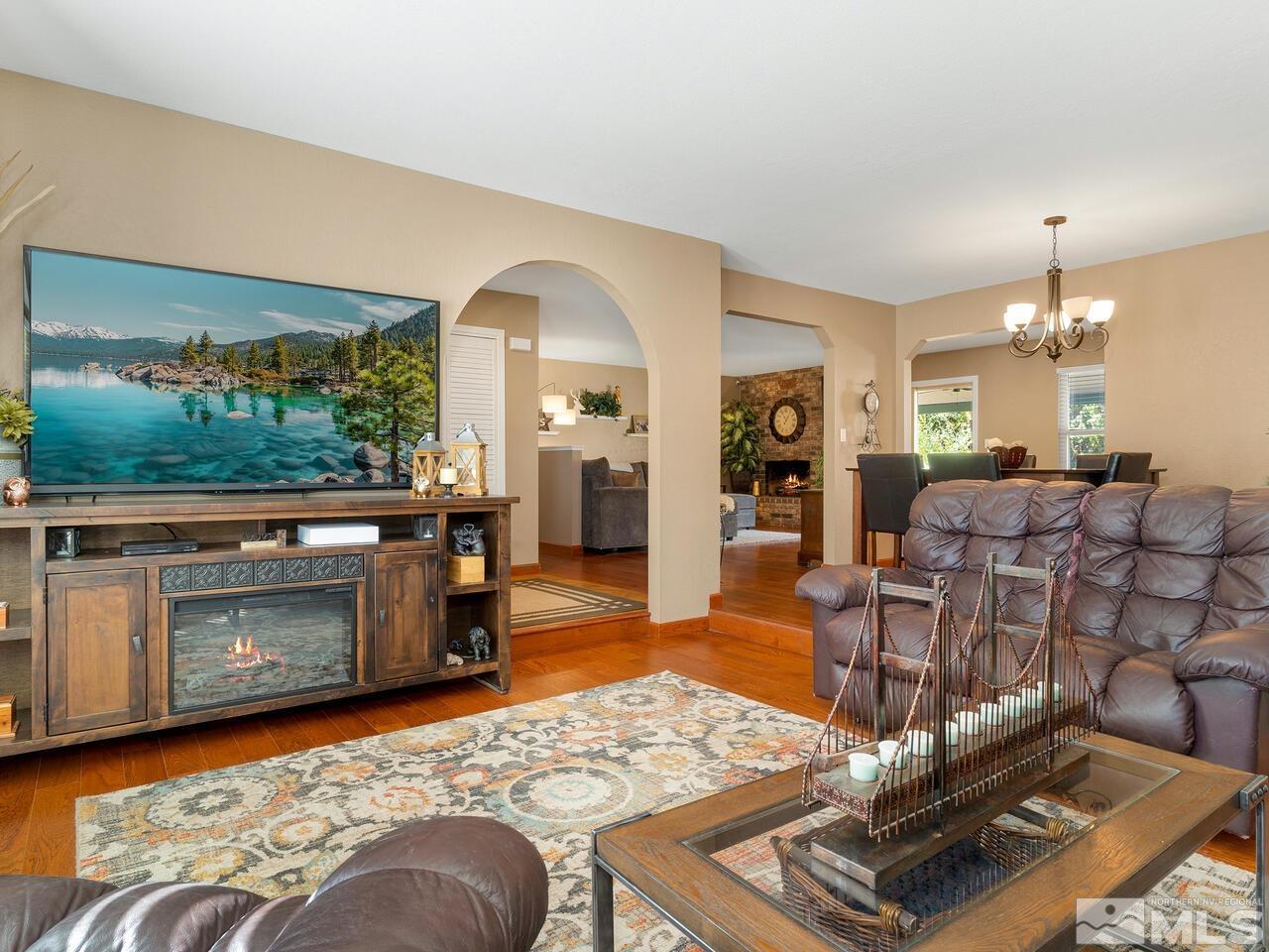10060 Raintree Court Reno, NV 89511 - Photo 9 of 37 a living room with furniture and a fireplace