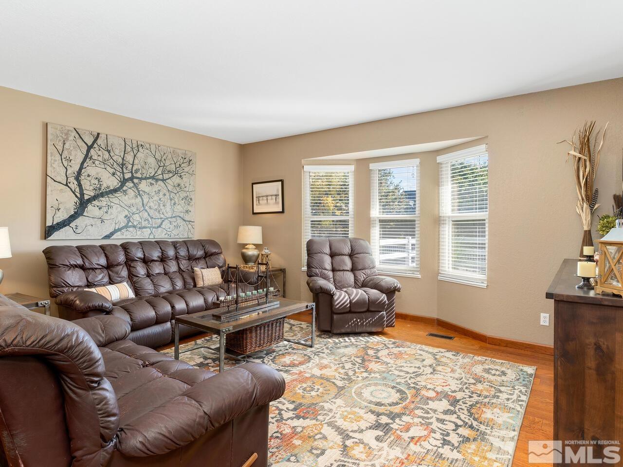10060 Raintree Court Reno, NV 89511 - Photo 10 of 37 a living room with furniture and a flat screen tv