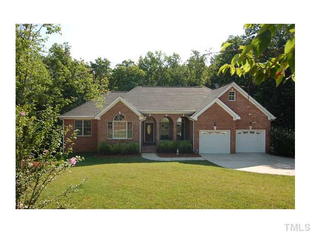 6911 Wexford Woods Trail Raleigh, NC 27613 - Photo 1 of 12 Custom 4BR, 3.5BA Brick Ranch w/ Daylight basement on .93 Acres. Beautiful and quiet culdesac lot. Home boasts 3 car garage (one with side entrance) and large workshop area.