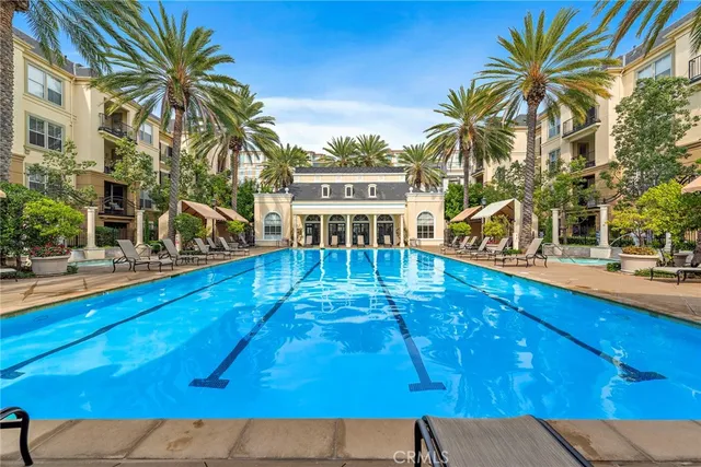a view of swimming pool with seating area and furniture