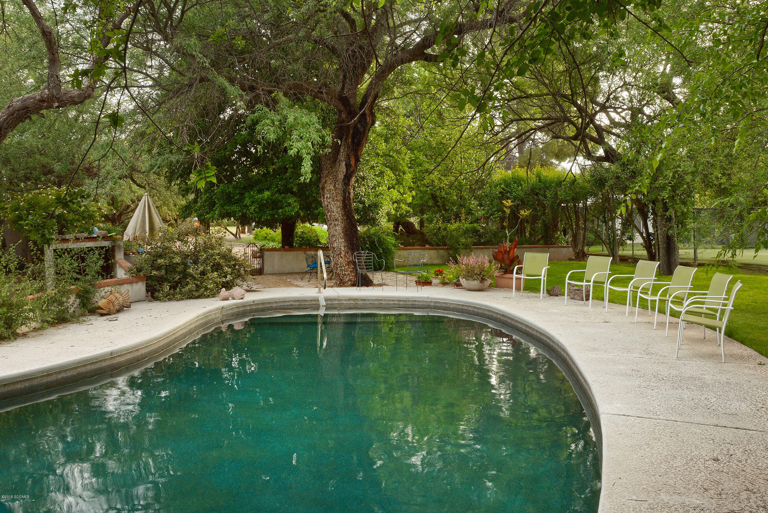 87 Clark Crossing Road Rio Rico, AZ 85648 - Photo 35 of 51 a swimming pool with a outdoor seating and yard