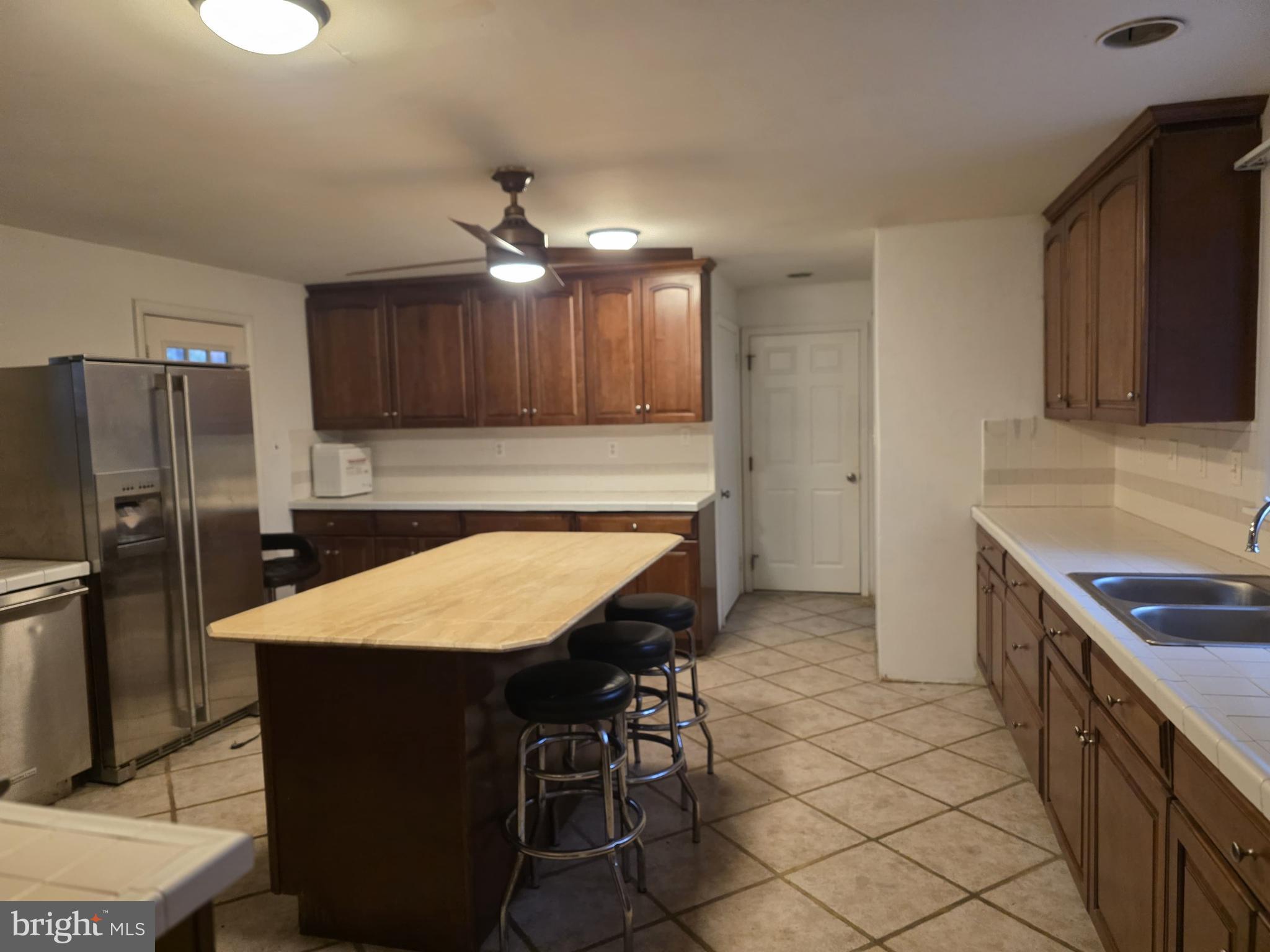 17 Cardinal Drive Moorestown, NJ 08057 - Photo 14 of 16 a kitchen with kitchen island a counter top space appliances and cabinets