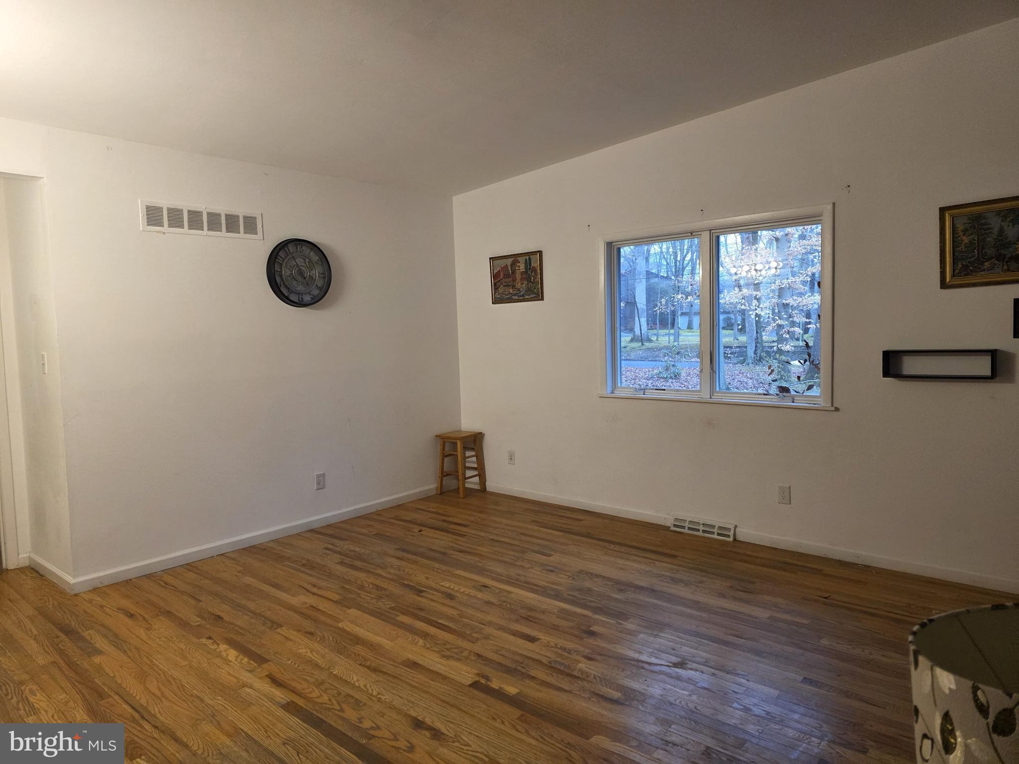 17 Cardinal Drive Moorestown, NJ 08057 - Photo 9 of 16 a view of a room with wooden floor and window