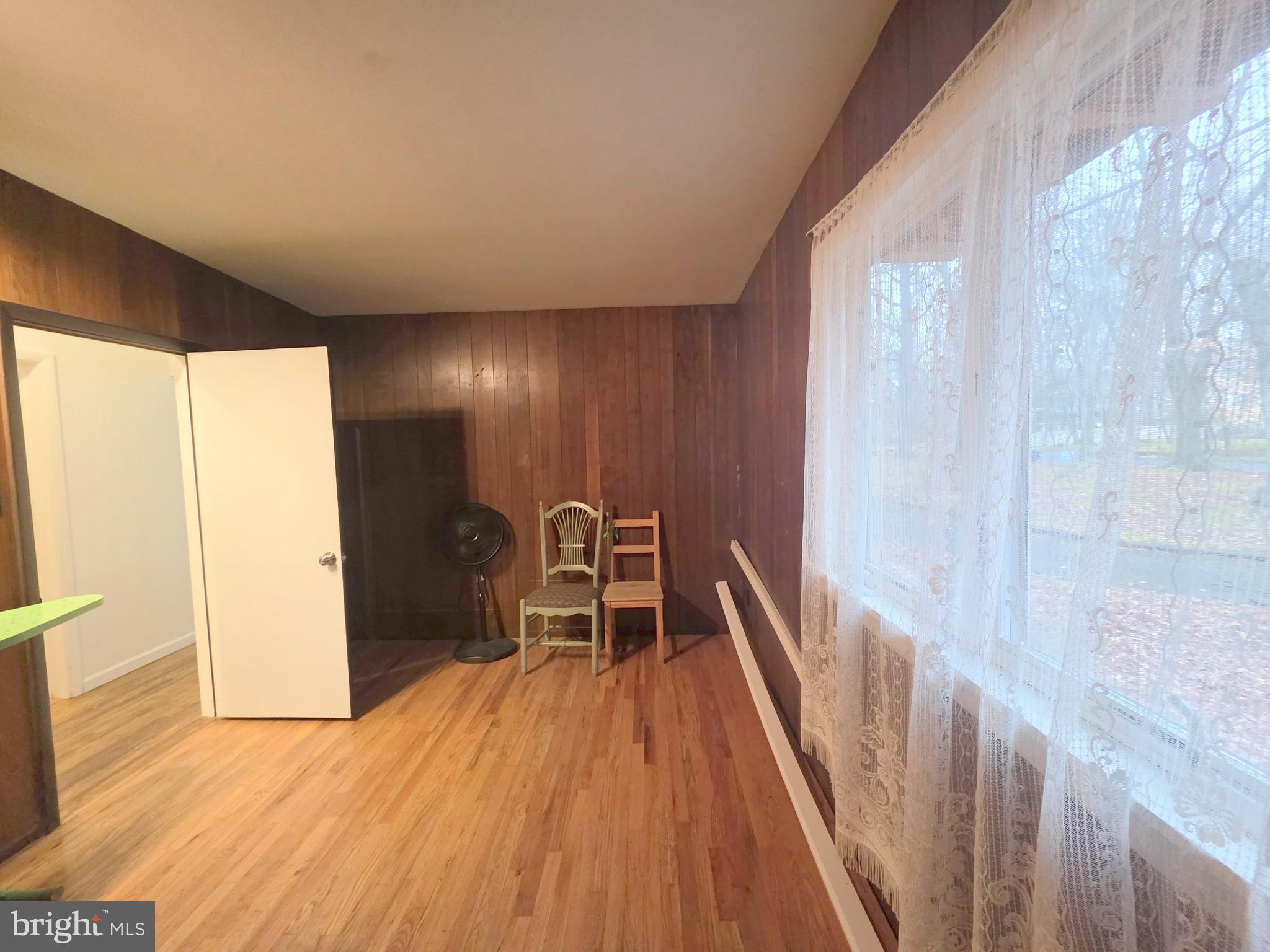 17 Cardinal Drive Moorestown, NJ 08057 - Photo 10 of 16 a view of a hallway with wooden floor and furniture