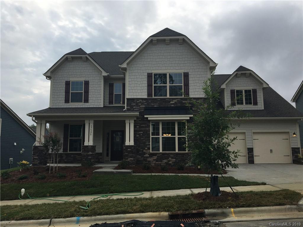 17526 Shearer Road, Unit 96 Davidson, NC 28036 - Photo 1 of 25 a front view of a house with a yard