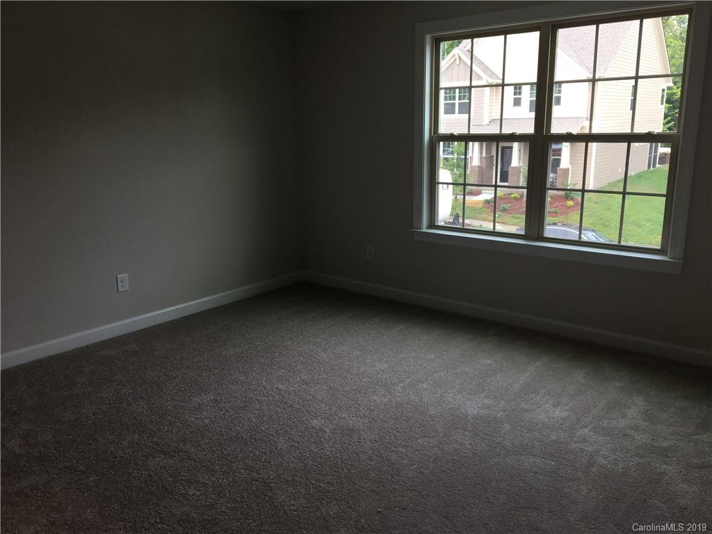 17526 Shearer Road, Unit 96 Davidson, NC 28036 - Photo 15 of 25 an empty room with a window
