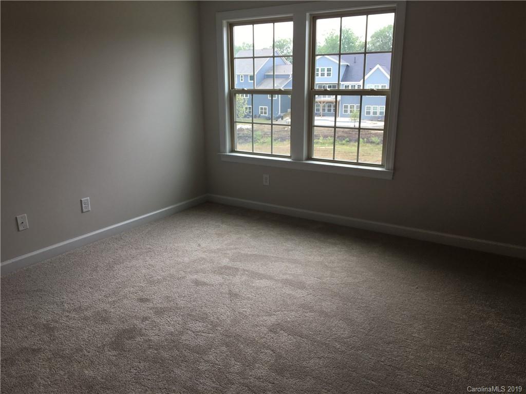 17526 Shearer Road, Unit 96 Davidson, NC 28036 - Photo 16 of 25 an empty room with a window