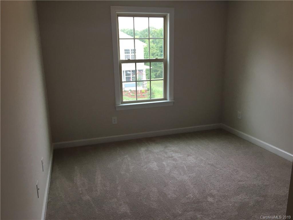 17526 Shearer Road, Unit 96 Davidson, NC 28036 - Photo 17 of 25 an empty room with a window